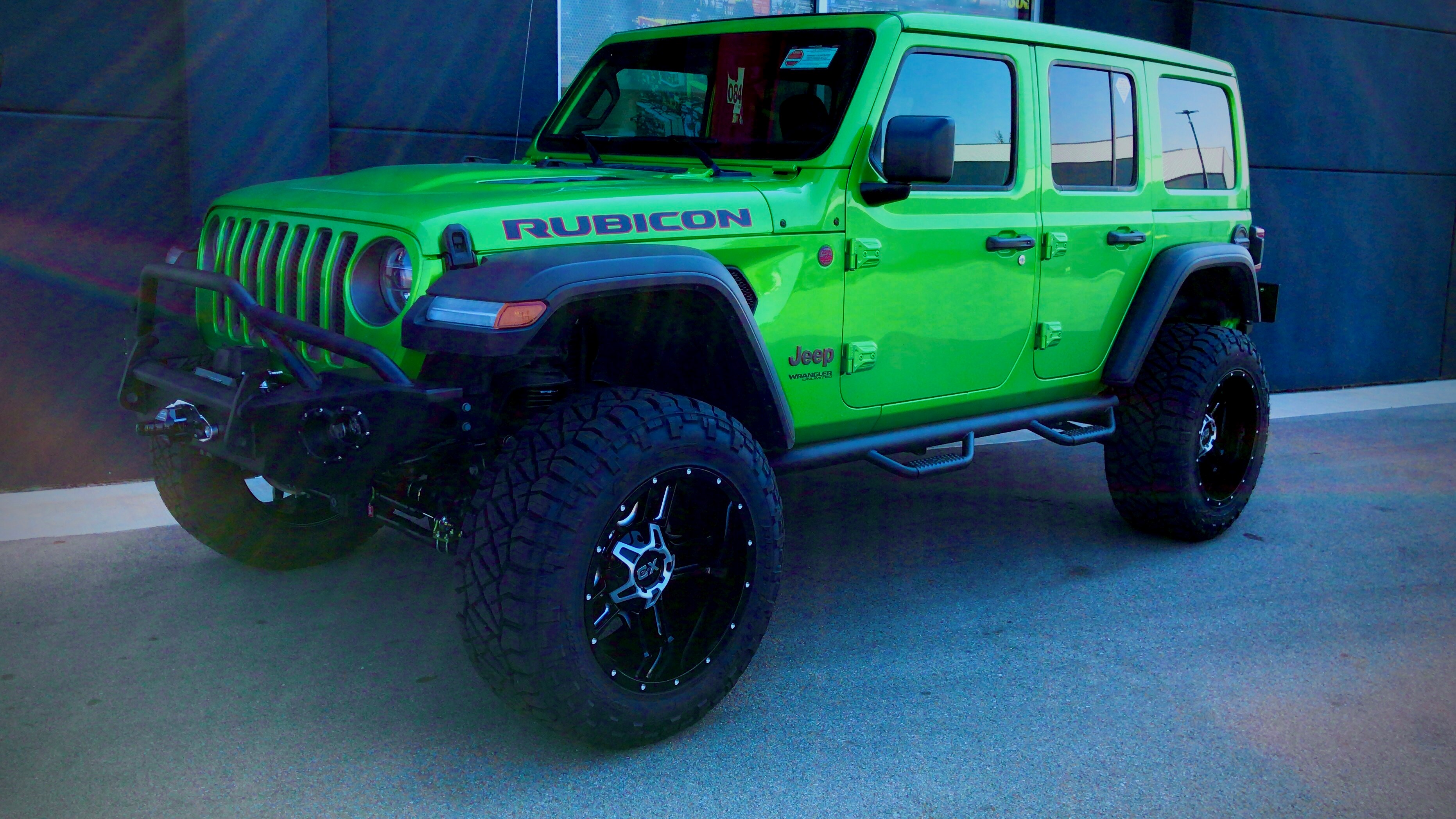 lifted JK Wrangler 2014 Dune color with Atlas bumpers from DSI